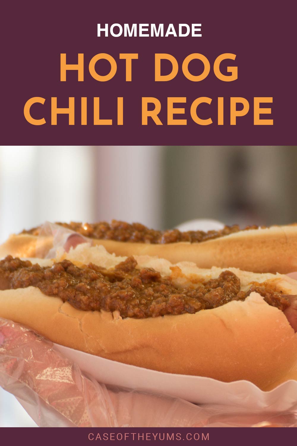 person wearing food prep gloves,holding a hot dog - Homemade Hot Dog Chili Recipe.